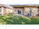 Backyard lawn with a view of the covered lanai at 114 Tuscany Villas Dr, Edgewater, FL 32141