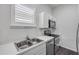 Modern kitchen featuring stainless steel appliances and white countertops at 114 Tuscany Villas Dr, Edgewater, FL 32141