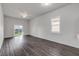 Spacious living room with lots of natural light and wood-look flooring at 114 Tuscany Villas Dr, Edgewater, FL 32141