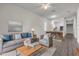Staged living room with modern furniture and an open concept design at 114 Tuscany Villas Dr, Edgewater, FL 32141