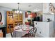 Open dining space next to a kitchen with wood cabinets and shelving at 1170 Calle Del Rey # D, Casselberry, FL 32707