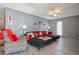 Living room offers a dark-colored sectional couch and gray walls at 1170 Calle Del Rey # D, Casselberry, FL 32707
