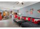 Comfortable living room shows off an L-shaped couch, and open access to the dining and kitchen areas at 1170 Calle Del Rey # D, Casselberry, FL 32707