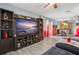 Open-concept living area features an entertainment center with a large flat-screen TV, and dining area at 1170 Calle Del Rey # D, Casselberry, FL 32707