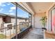 Screened patio with view of the building exterior, door, and potted plant at 1170 Calle Del Rey # D, Casselberry, FL 32707