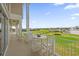Enjoy golf course views from this relaxing balcony, furnished with seating for outdoor dining and entertaining at 1432 Titian Ct, Reunion, FL 34747