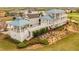 Stunning multi-story home with a unique spiral staircase and lush landscaping, perfect for outdoor living at 1432 Titian Ct, Reunion, FL 34747