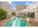 Private pool and spa surrounded by brick pavers, lounge seating, and lush landscaping for outdoor enjoyment at 1432 Titian Ct, Reunion, FL 34747