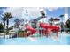 Community splash park featuring multiple slides, water features, and a bucket drop at 1432 Titian Ct, Reunion, FL 34747