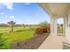 Picturesque golf course view from the patio, complemented by lush landscaping and a tranquil setting at 1432 Titian Ct, Reunion, FL 34747
