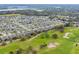 Picturesque aerial view of a residential community and golf course at 1503 Dusty Pine Dr, Apopka, FL 32703