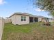 Spacious backyard featuring a screened lanai and room for outdoor activities at 1503 Dusty Pine Dr, Apopka, FL 32703