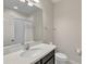 Bathroom featuring a single sink vanity with granite countertop and tiled shower-tub combo at 15489 Honeybell Dr, Winter Garden, FL 34787