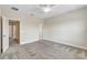 Carpeted bedroom with ceiling fan and open door; second bedroom visible in background at 15489 Honeybell Dr, Winter Garden, FL 34787