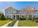Charming two-story townhome with a well-maintained lawn and inviting front entrance at 15489 Honeybell Dr, Winter Garden, FL 34787