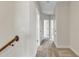 Hallway with carpet and neutral-colored walls offers access to multiple rooms at 15489 Honeybell Dr, Winter Garden, FL 34787