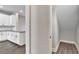 Hallway featuring view to kitchen and doorway to storage space at 15489 Honeybell Dr, Winter Garden, FL 34787