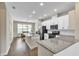 Modern kitchen with granite countertops, stainless steel appliances, and a bright dining area at 15489 Honeybell Dr, Winter Garden, FL 34787