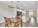 Open-concept kitchen and dining area with modern finishes and ample natural light at 15489 Honeybell Dr, Winter Garden, FL 34787