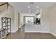 Bright, open-concept living space with modern flooring and seamless flow into the kitchen at 15489 Honeybell Dr, Winter Garden, FL 34787