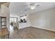 Spacious living area showcasing modern floors, recessed lighting, and seamless transition to the kitchen at 15489 Honeybell Dr, Winter Garden, FL 34787