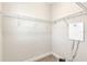 Walk-in closet with built-in metal shelving on white walls and carpeted floors at 15489 Honeybell Dr, Winter Garden, FL 34787