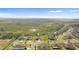Aerial view of the neighborhood highlighting the home's proximity to green spaces and community layout at 16413 Bloom Ct, Groveland, FL 34736