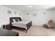 Comfortable bedroom featuring a well-lit space with a king-size bed and cozy decor at 16413 Bloom Ct, Groveland, FL 34736