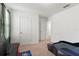 This bedroom offers carpeted floors, neutral paint and ample space for various furniture arrangements at 16413 Bloom Ct, Groveland, FL 34736
