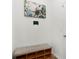 Clean entryway featuring a bench with storage and modern art above at 16413 Bloom Ct, Groveland, FL 34736