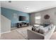 Inviting living room with a stylish entertainment center and a plush sectional sofa with decorative pillows at 16413 Bloom Ct, Groveland, FL 34736