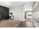 Open-concept living space with views of an office area and sliding glass doors leading outside at 16413 Bloom Ct, Groveland, FL 34736