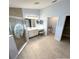 Bathroom featuring walk-in shower and vanity with ample lighting at 1733 Weeping Elm Cir, Port Orange, FL 32128
