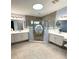 Spacious bathroom featuring walk-in shower with dual vanities at 1733 Weeping Elm Cir, Port Orange, FL 32128