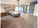 Bedroom features wood floors, a ceiling fan, and plenty of natural light at 1733 Weeping Elm Cir, Port Orange, FL 32128