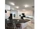 Kitchen featuring granite countertops with a breakfast bar and overhead lighting at 1733 Weeping Elm Cir, Port Orange, FL 32128