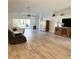 Bright living room with new floors, vaulted ceiling, and access to outdoor patio at 1733 Weeping Elm Cir, Port Orange, FL 32128