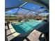Relaxing screened pool area with clear water, fountains, and a view of the serene landscape at 1733 Weeping Elm Cir, Port Orange, FL 32128