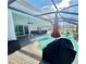 Inviting screened pool area with outdoor seating and sunny views of the backyard at 1733 Weeping Elm Cir, Port Orange, FL 32128