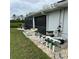 Pool equipment on the side of the house with a view of a backyard pond at 1733 Weeping Elm Cir, Port Orange, FL 32128