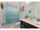 Charming bathroom with shower-tub combo, framed mirror and vanity with ample counter space at 1841 Sawyer Palm Pl, Kissimmee, FL 34747