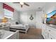 Cozy bedroom featuring twin beds, ceiling fan, dresser with TV, and ample closet space at 1841 Sawyer Palm Pl, Kissimmee, FL 34747