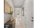 Bright hallway featuring neutral tones and stylish decor at 1841 Sawyer Palm Pl, Kissimmee, FL 34747