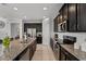 Modern kitchen with an island, granite countertops, and stainless appliances at 1841 Sawyer Palm Pl, Kissimmee, FL 34747