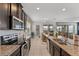 Modern kitchen with granite countertops and stainless steel appliances at 1841 Sawyer Palm Pl, Kissimmee, FL 34747