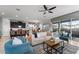 Beautiful living area leading to a covered patio and pool, showcasing a modern kitchen at 1841 Sawyer Palm Pl, Kissimmee, FL 34747