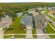 Overhead view of the home showcasing its location and backyard pond at 2214 Windcrest Lake Cir, Orlando, FL 32824