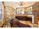 A luxurious bathroom featuring a standalone copper tub, a large glass shower, and a vanity with dual sinks at 2313 Roat Dr, Orlando, FL 32835