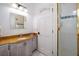 Bathroom features a granite countertop, decorative tiling, and a glass-enclosed shower, and a mirrored vanity at 2313 Roat Dr, Orlando, FL 32835