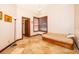 A bedroom with a window, closet and stone floors at 2313 Roat Dr, Orlando, FL 32835